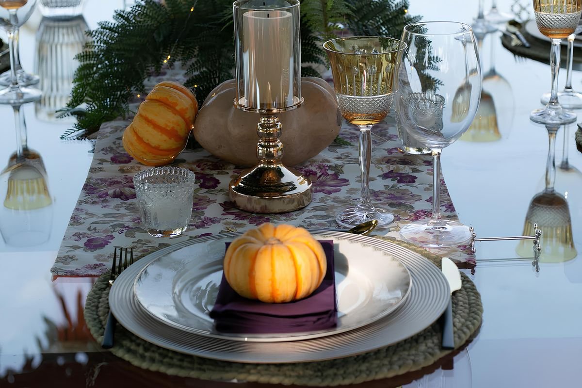 Entryway bench with pumpkin cushions and a basket of blankets halloween home decor