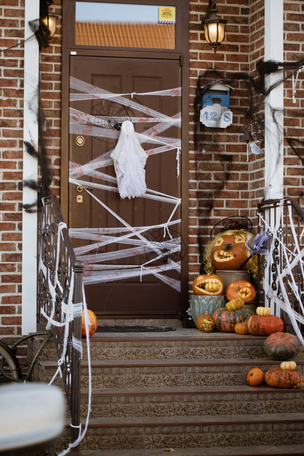 White painted leaves with ghost faces displayed in frames halloween craft art