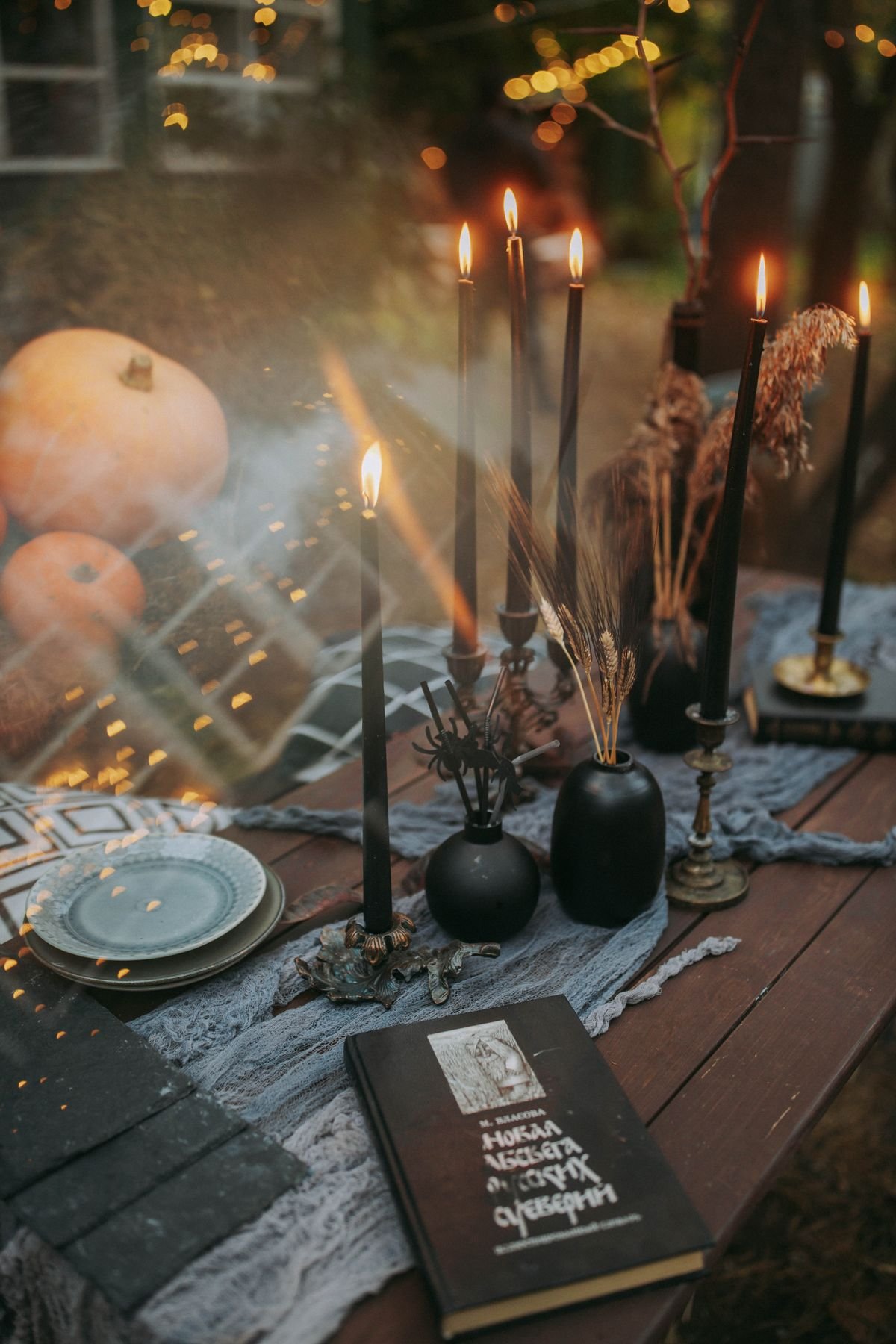 Burning black taper candles styled for elegant halloween home decor