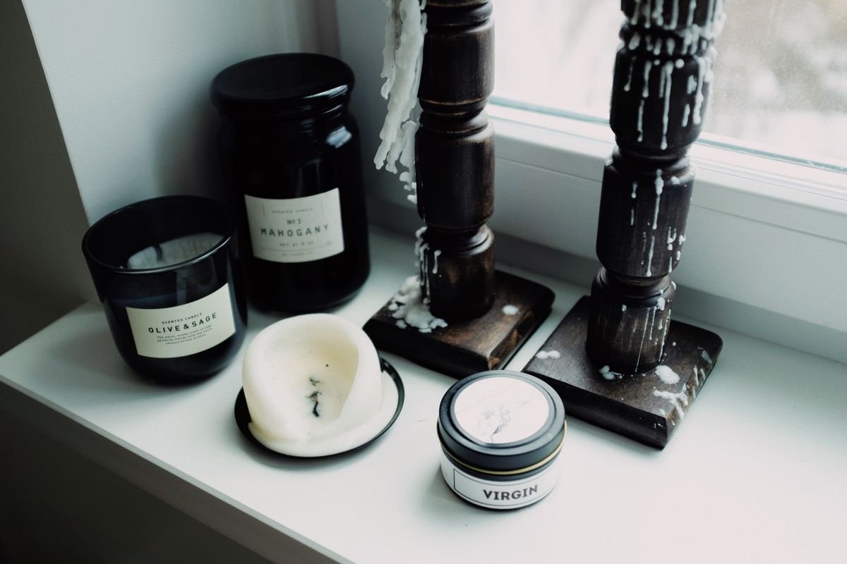 Cluster of candles on a windowsill, an elegant halloween lighting idea