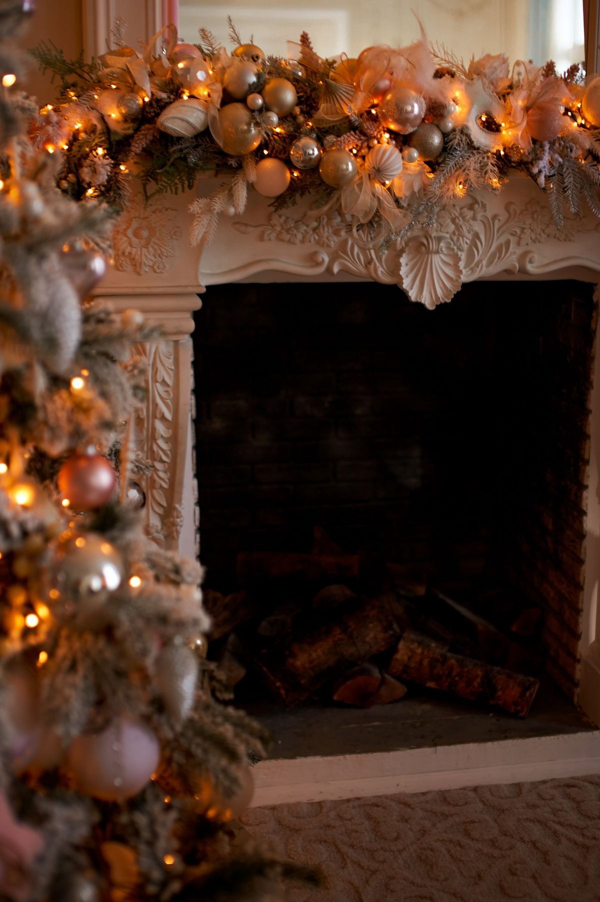 Fireplace mantel styled with fall garland and pumpkins, halloween transition decor