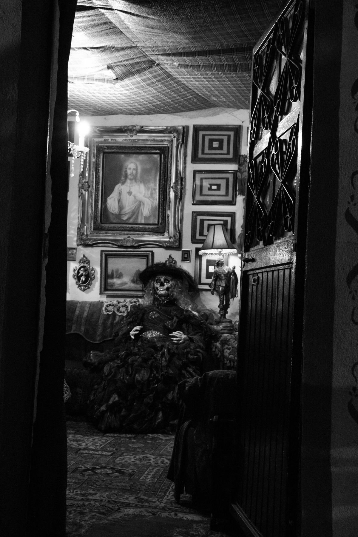 Dark Victorian-style living room with Halloween decor