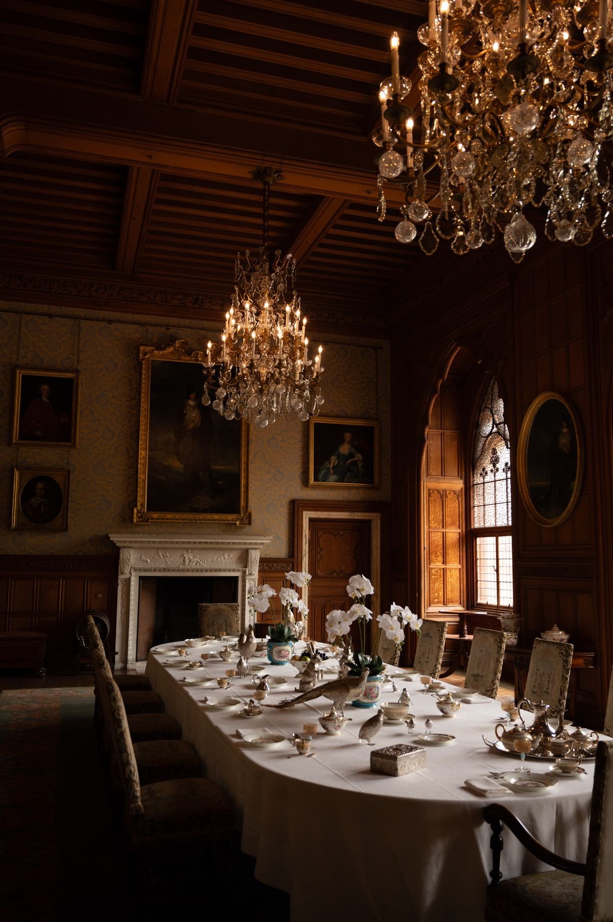 Gothic chandelier above a Halloween dining table