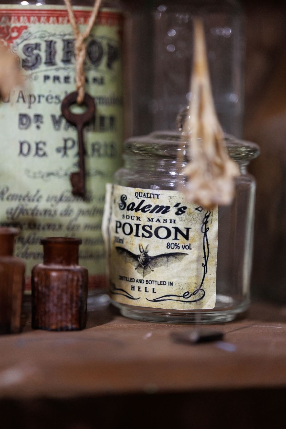 Gothic apothecary jars filled with Halloween curiosities