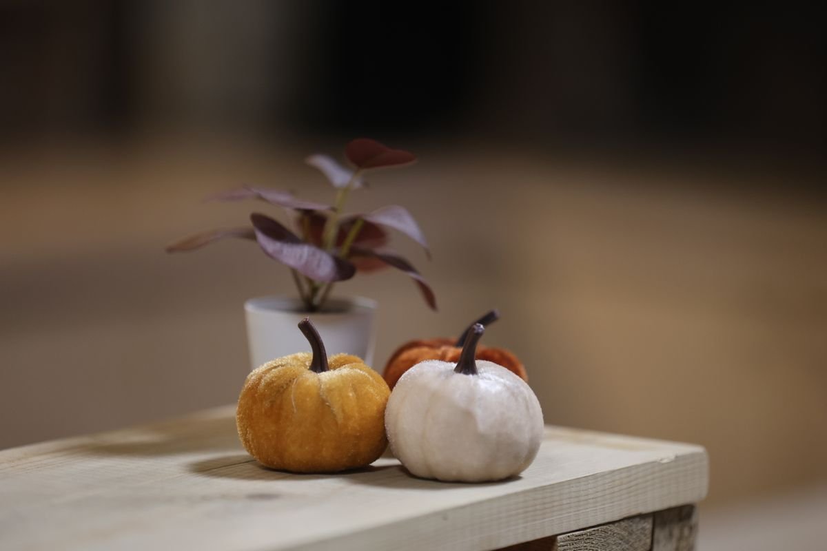 Small pumpkin on a bedside table for subtle halloween bedroom decor