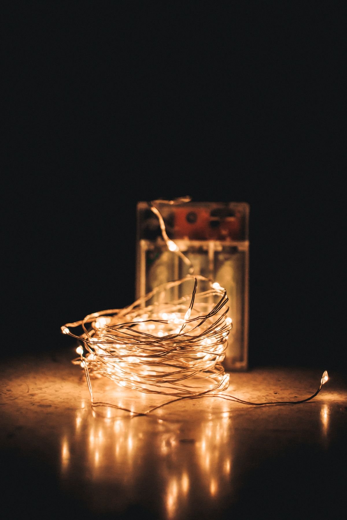Warm fairy lights glowing in a cosy living room for halloween