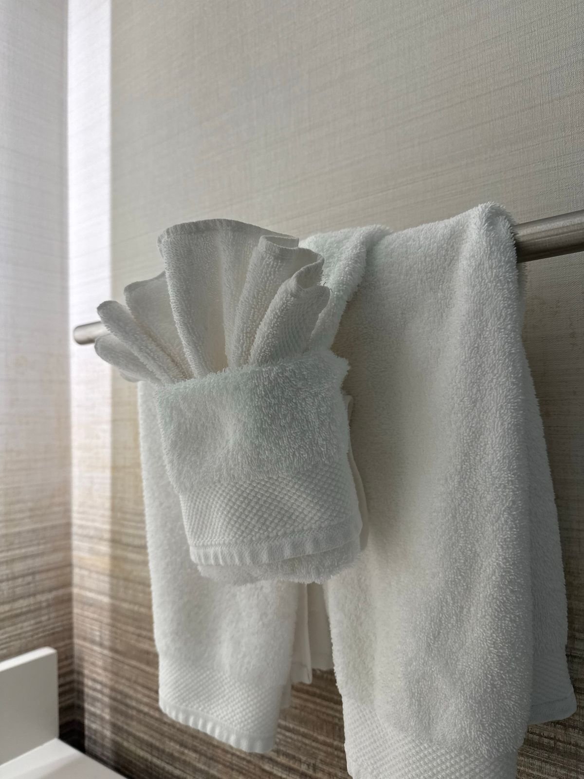 Bathroom with rust coloured towel and amber soap for autumn