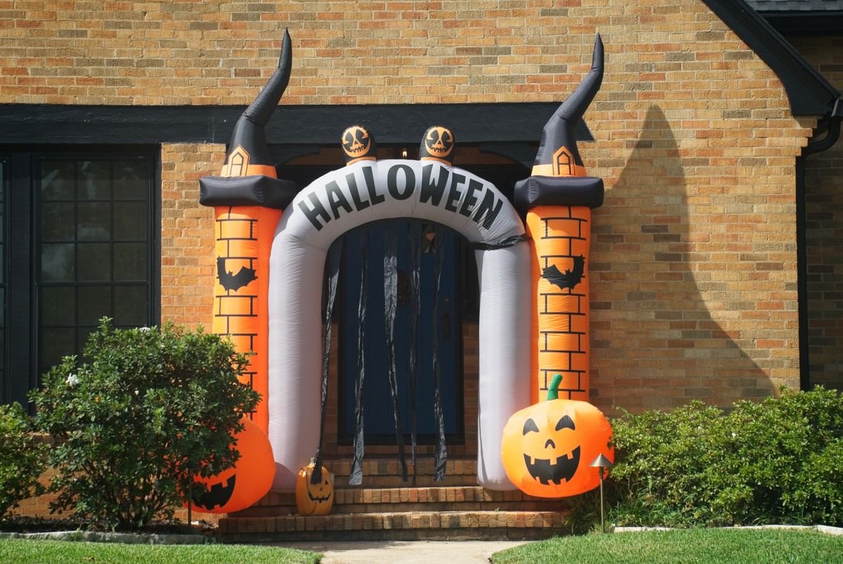Pumpkin, lantern and wrought iron furniture on a fall patio