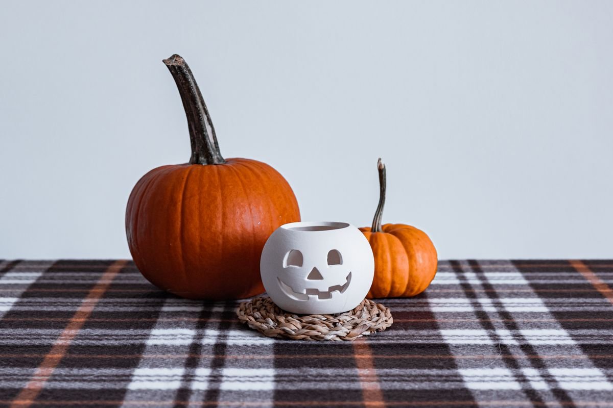 Plaid flannel tablecloth with pumpkin centrepiece for fall halloween dining