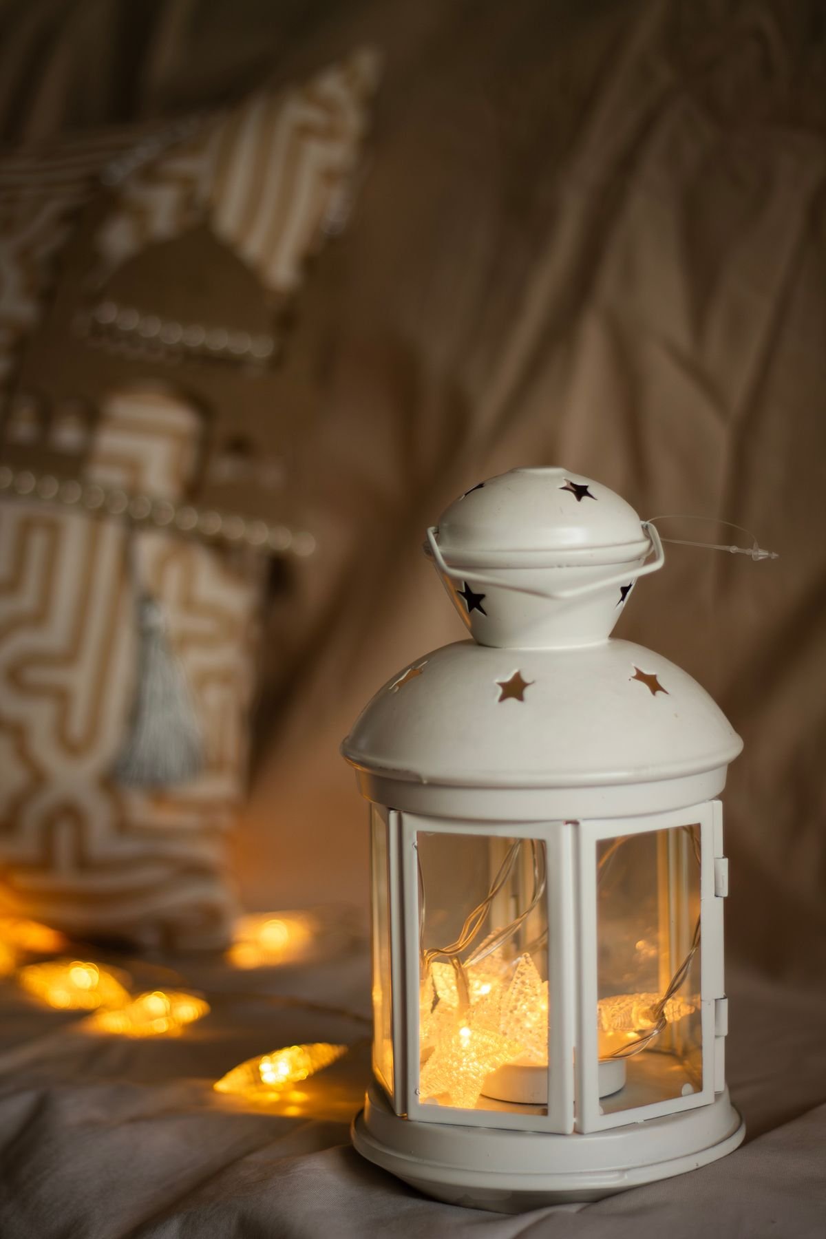 Flickering lanterns adding spooky light to Halloween living room