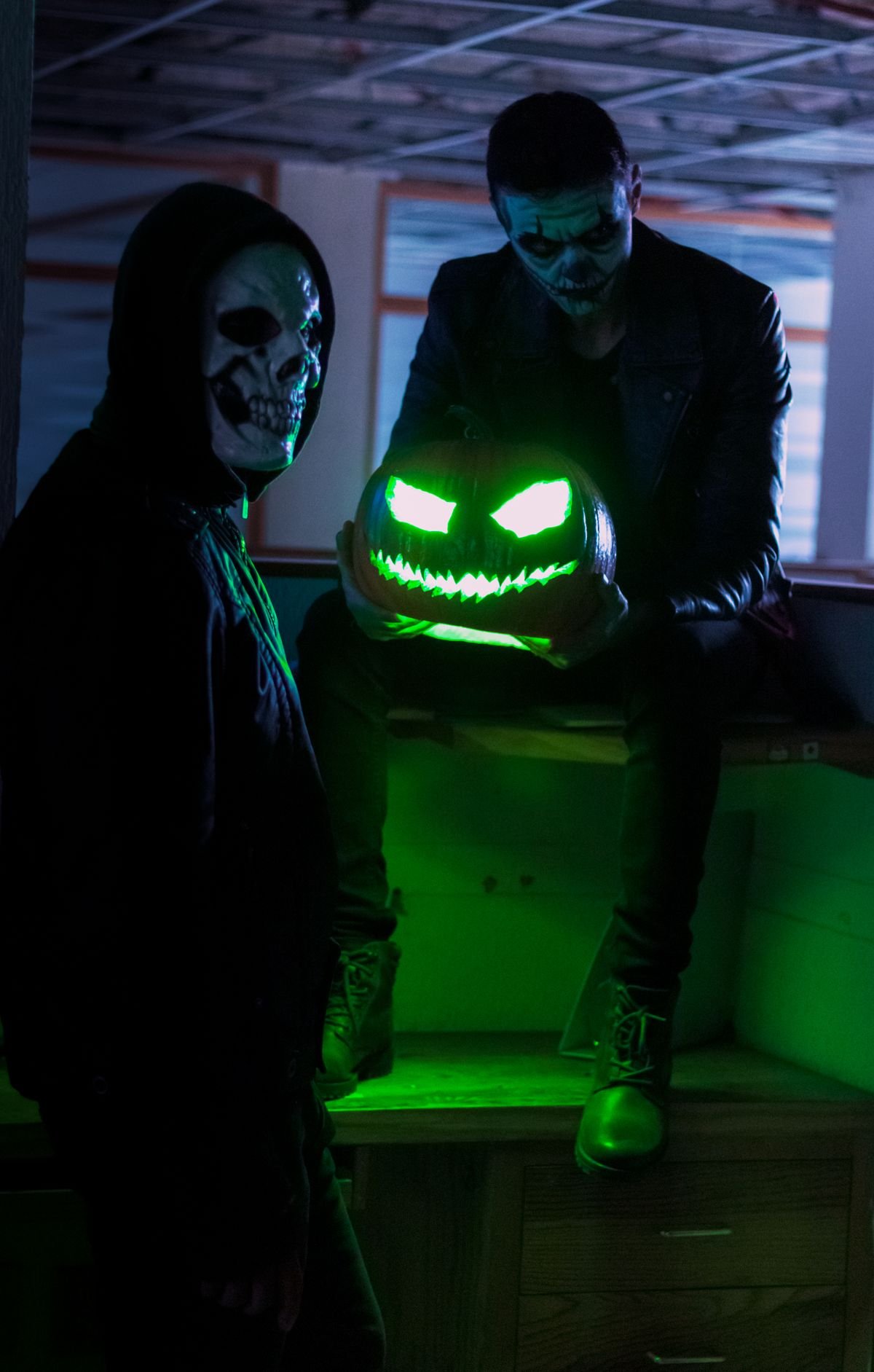 Glowing pumpkin lamp on a bedroom nightstand for home decor halloween ideas