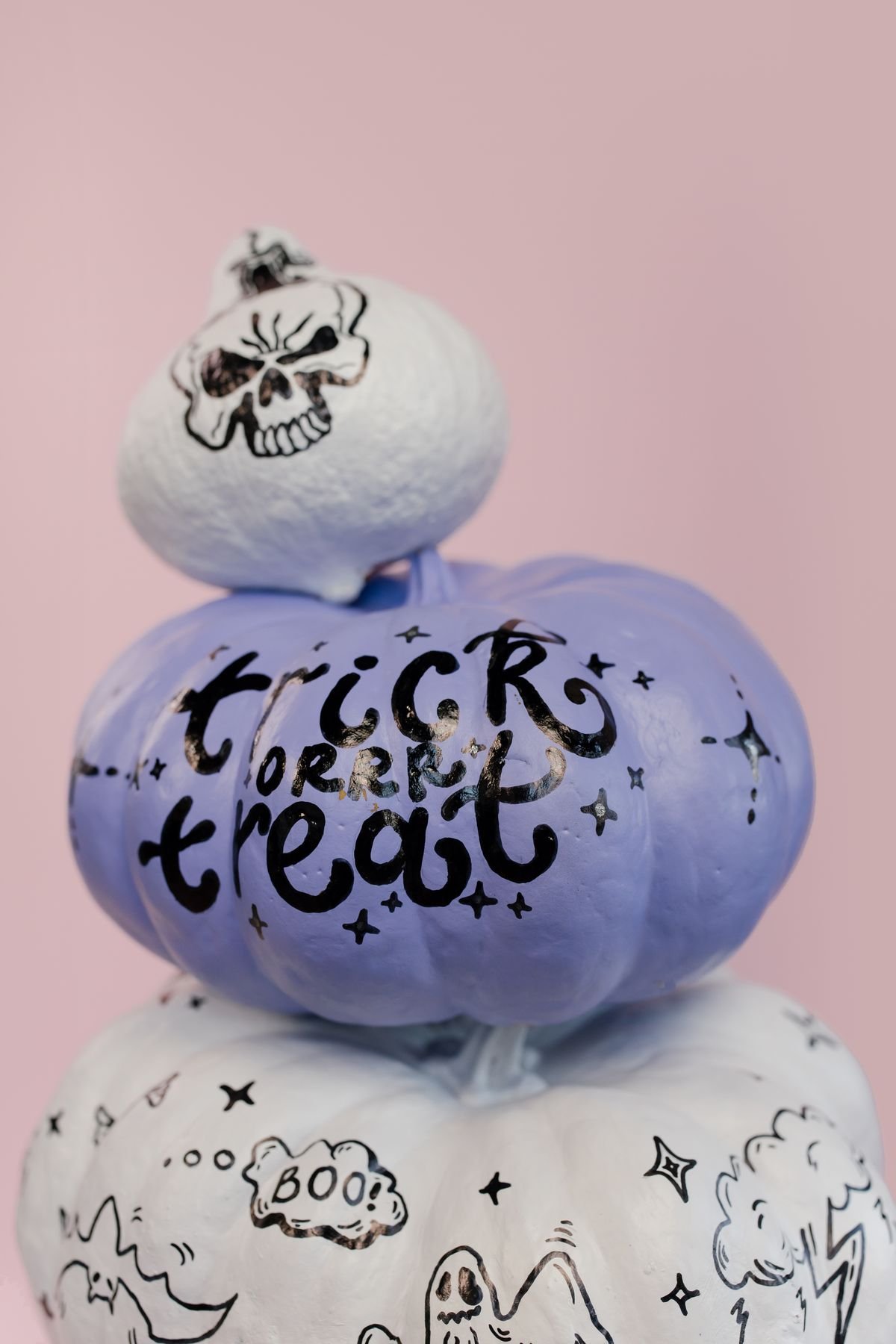 Hand painted pumpkins in halloween colours as a diy craft project