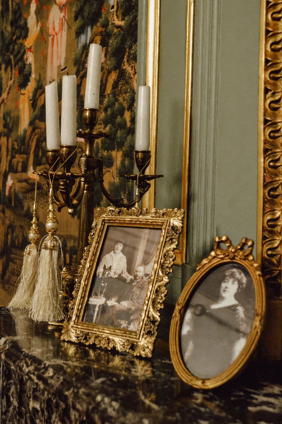 Elegant candelabra with candles on a console table in a halloween living room