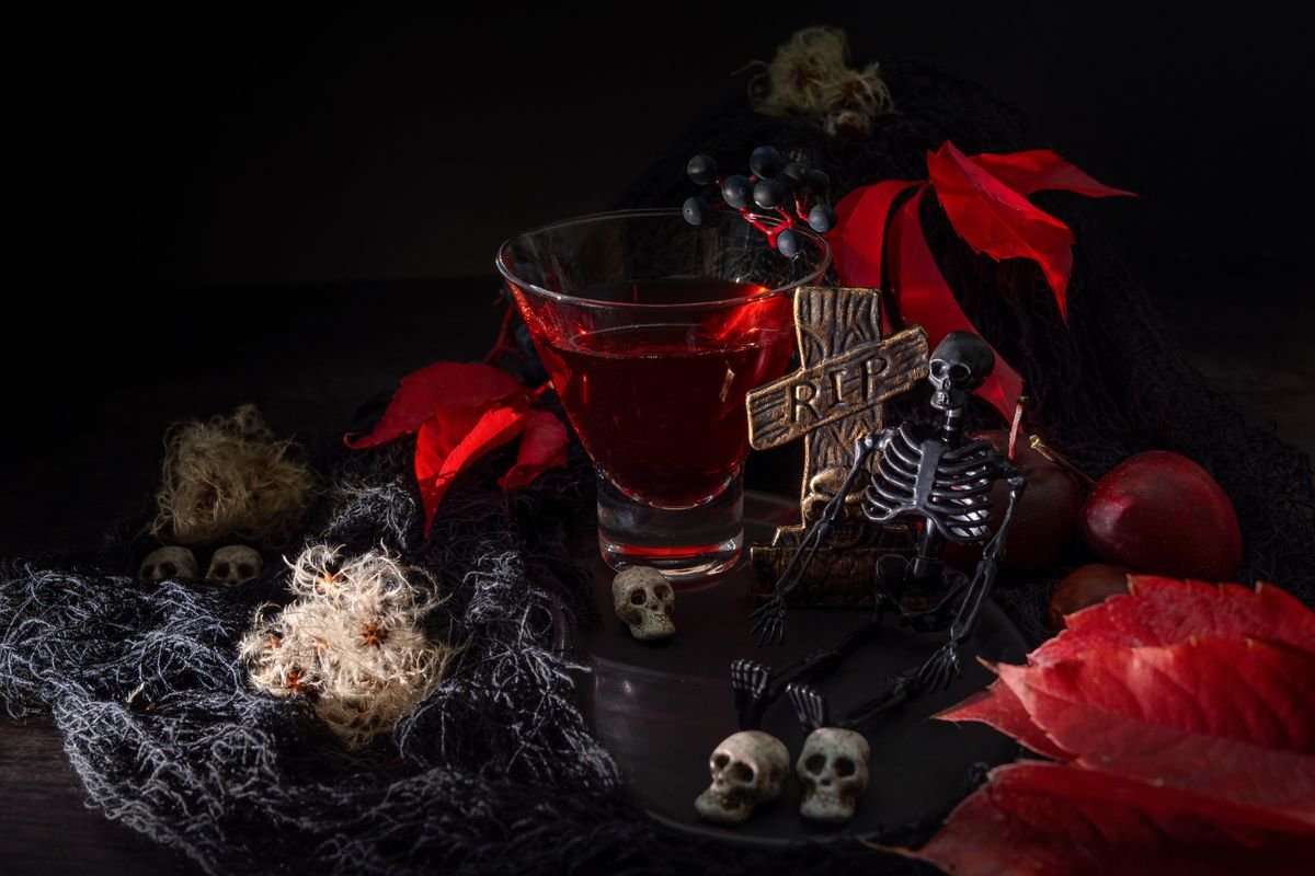 Halloween dessert table with cake stands and spooky treats