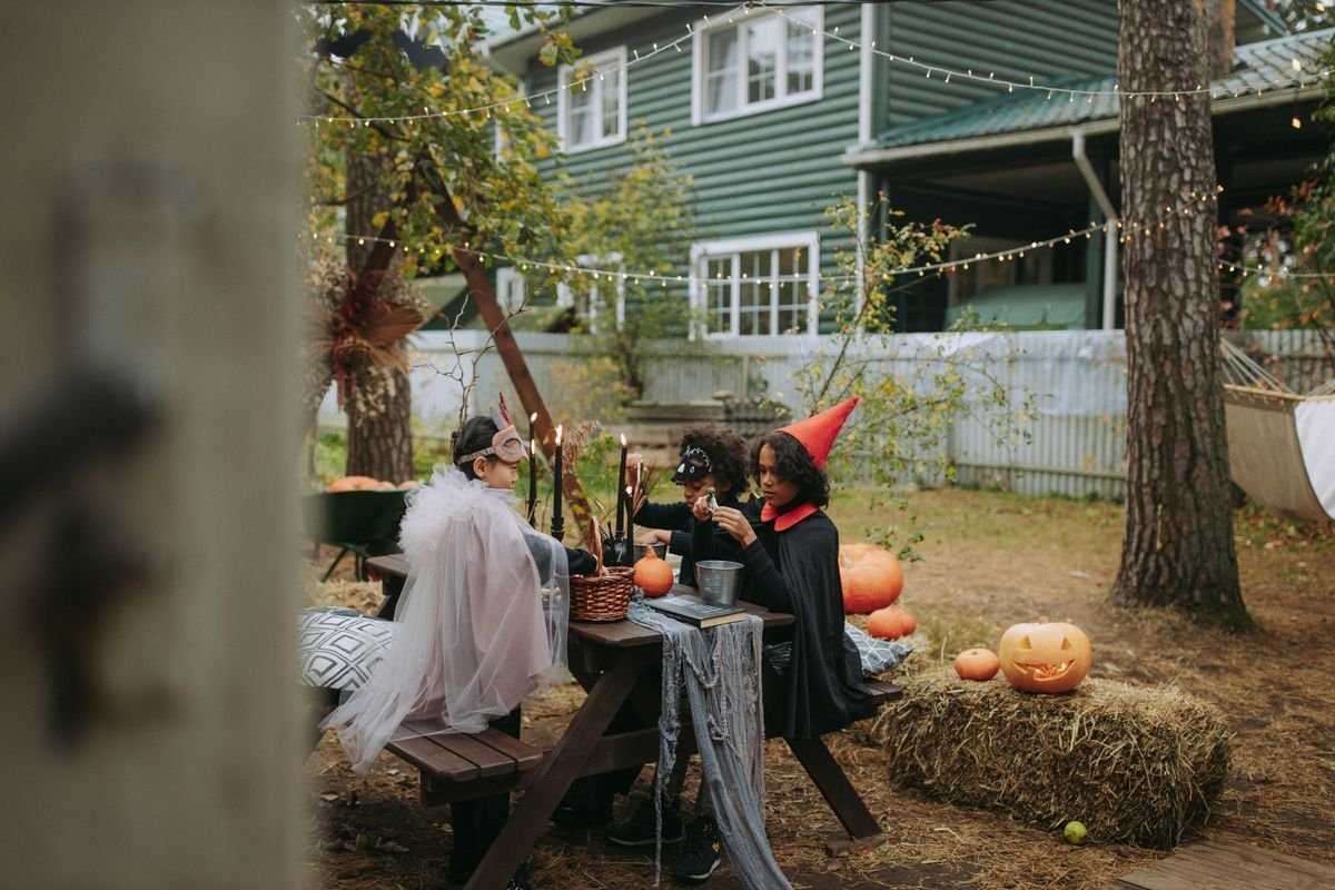 Speaker and halloween playlist setup in a party corner