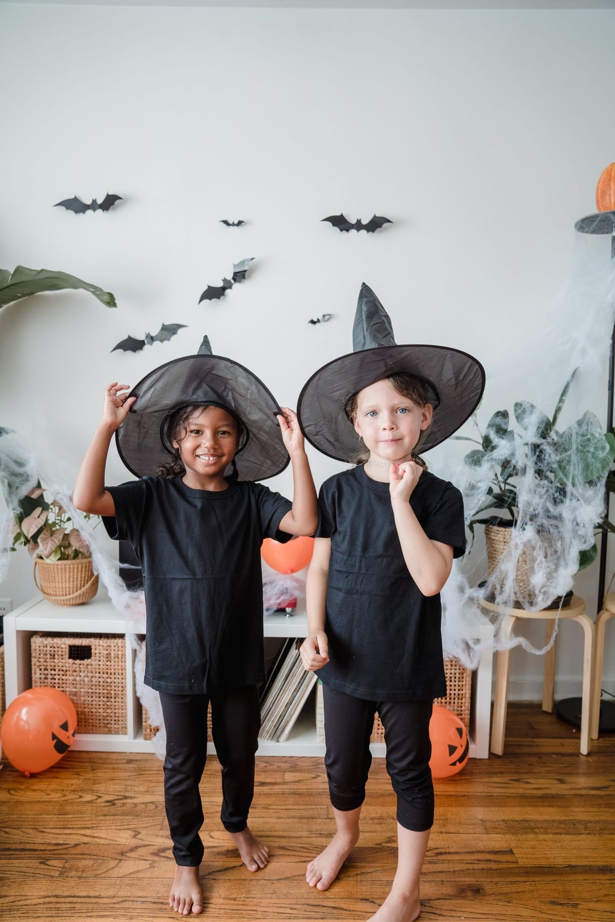 Halloween party favour bags with sweets on a decorated table
