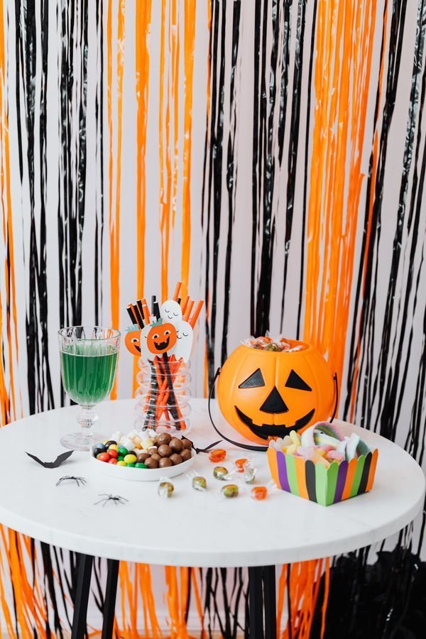 Cozy candlelit Halloween corner vignette indoors