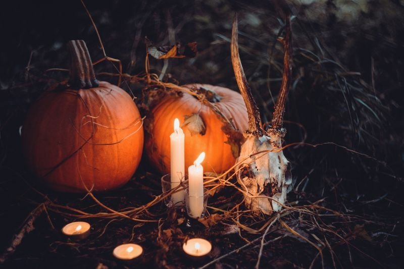 Groupings of flickering candles for indoor Halloween ambiance