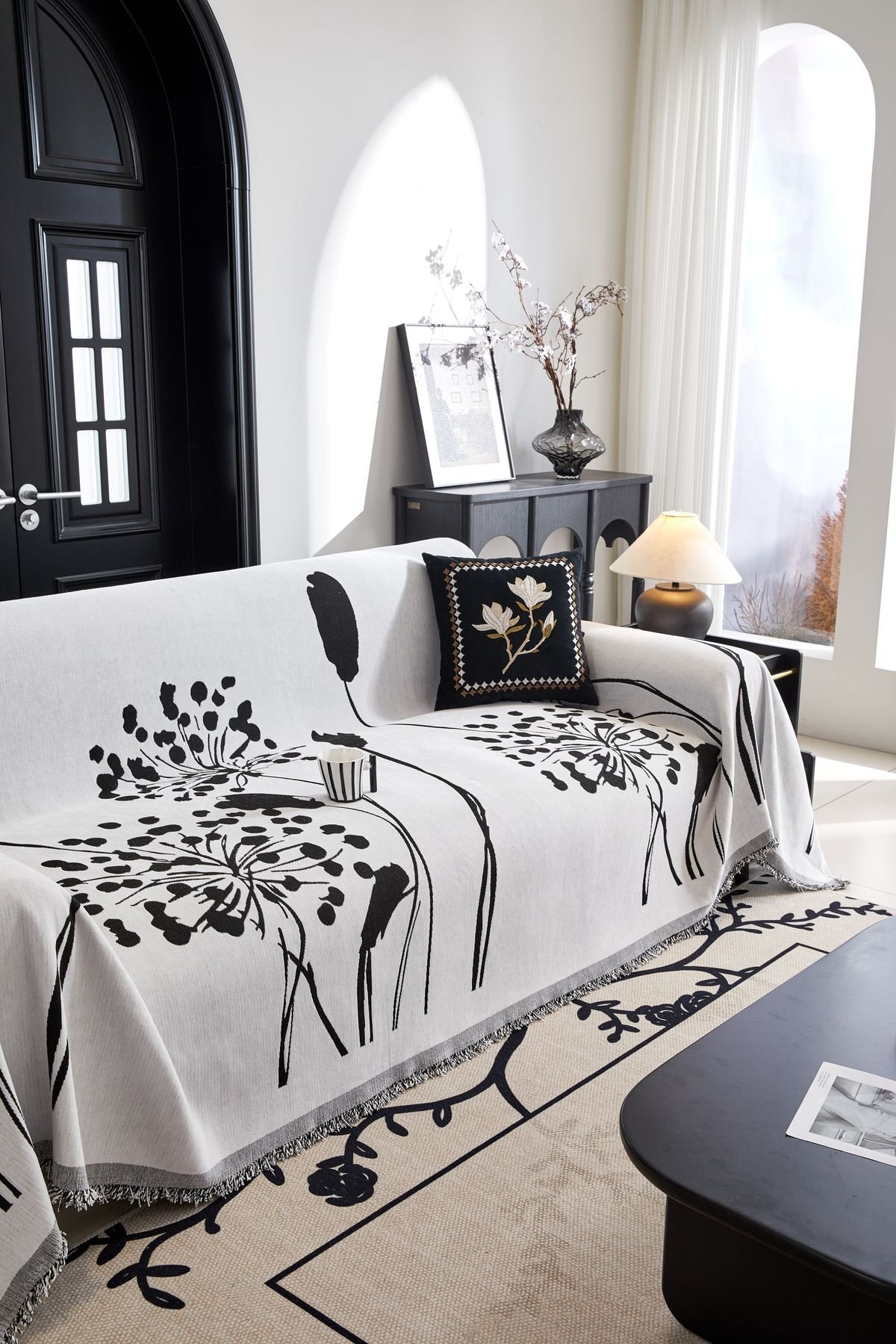 Black throw draped over a sofa arm