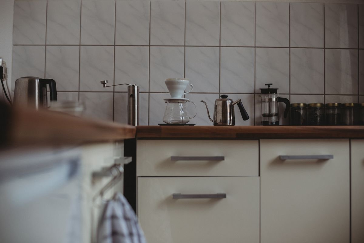 Mug station with pumpkins on a kitchen counter