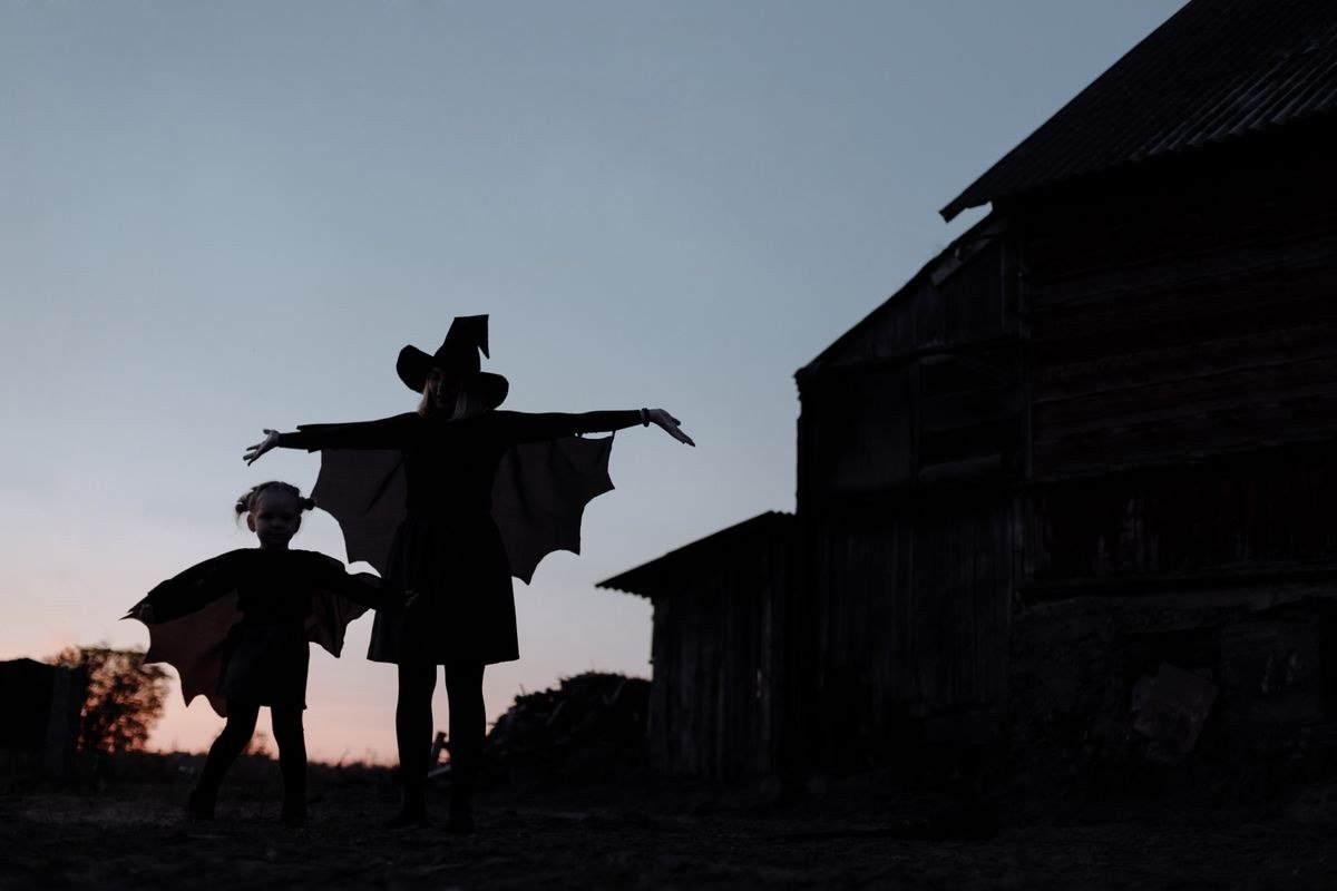 Witch silhouette at sunset for a moonlit Halloween entrance finish